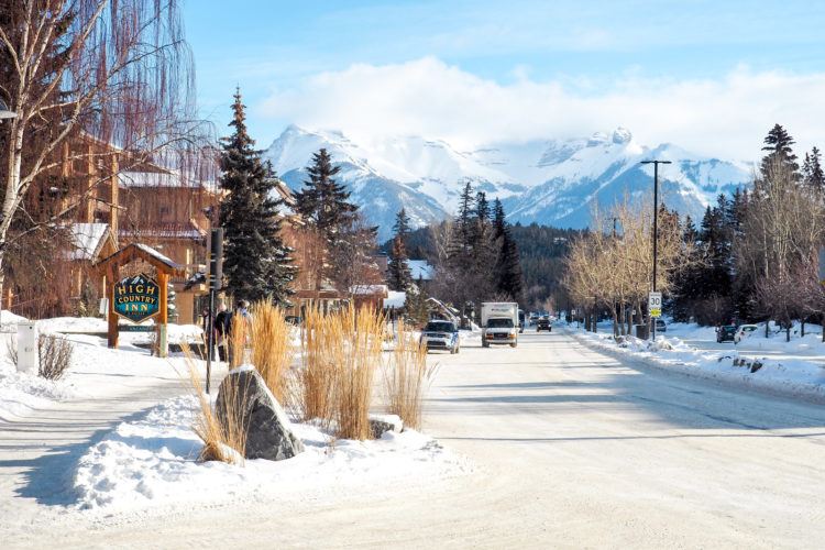 downtown BANFF in alberta, canada, oversized scarf, sorel boots, winter  outfit idea